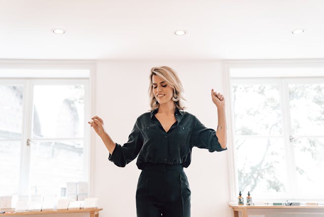 IV ketamine Woman in her late 30s dancing with joy