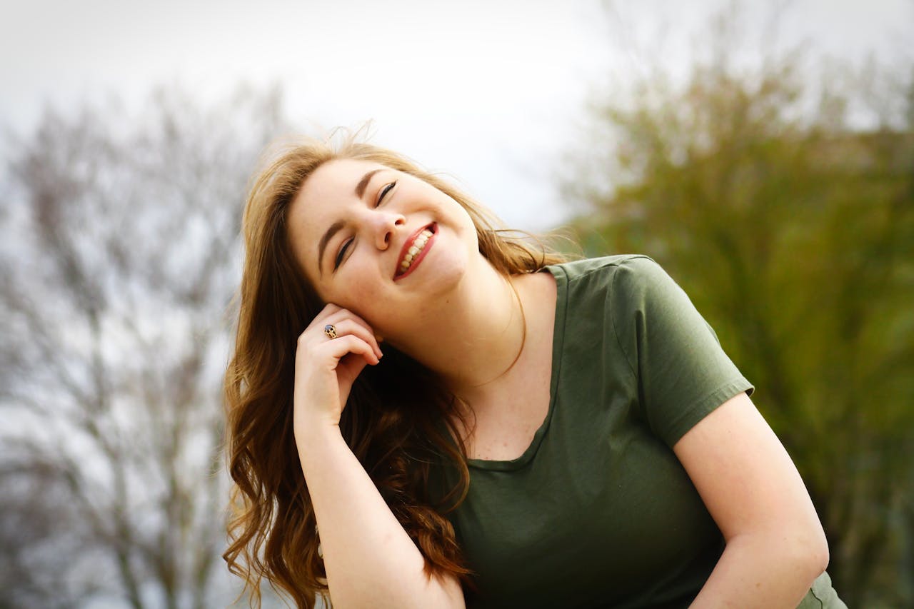 Happy woman enjoying a sunny day outdoors