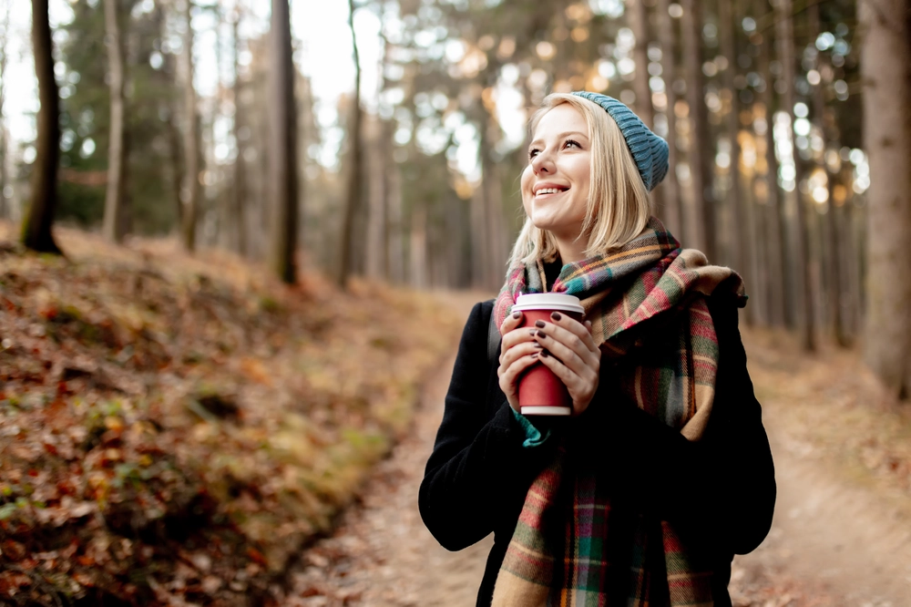 beautiful-blond-girl-in-blue-hat-with-cup-of-coffee