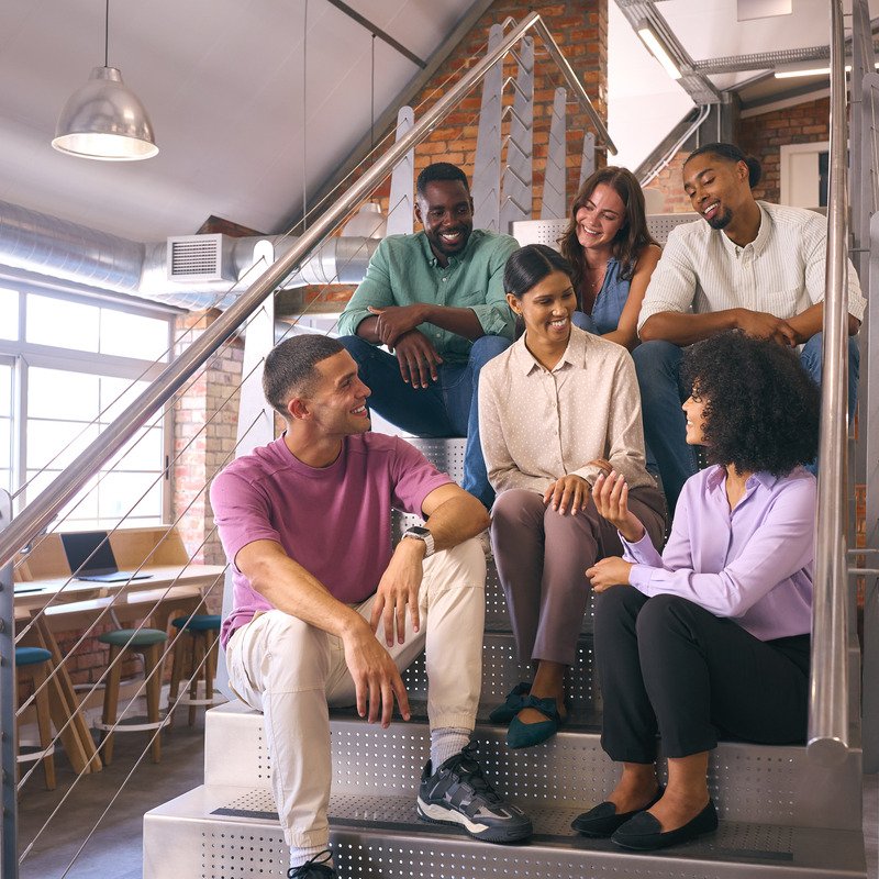 smiling-multi-cultural-business-team-sitting
