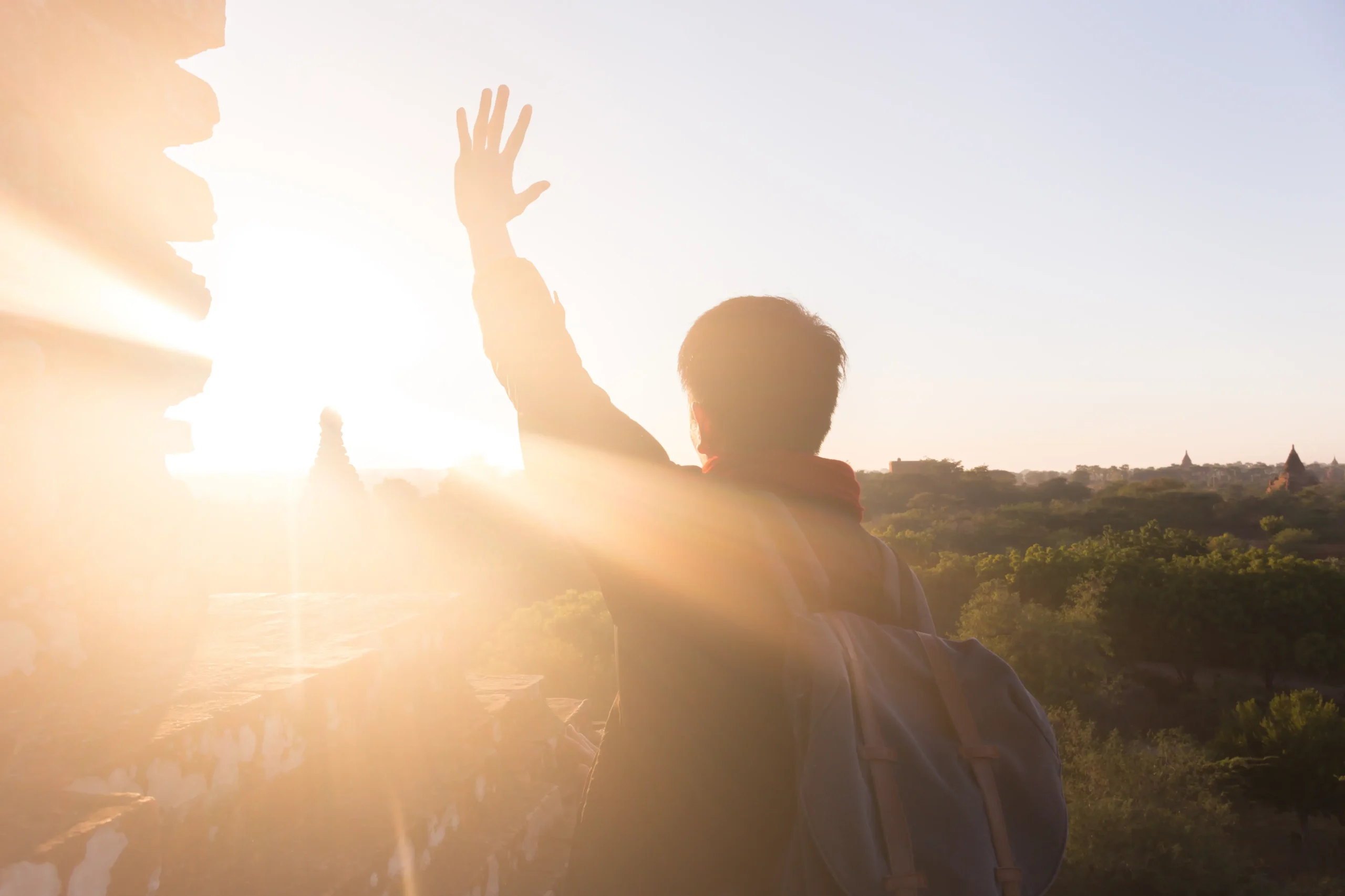 silhouette-of-young-male-backpacker-watching-sun